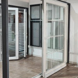 In parallel-sliding PVC doors 2950x2250 mm with Interstitial sprats, profile color imitation of light concrete