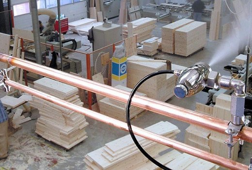 Dust suppression with mist systems in woodworking