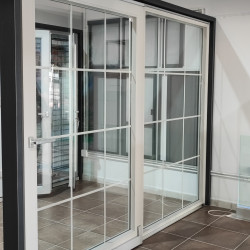 In parallel-sliding PVC doors 2950x2250 mm with Interstitial sprats, profile color imitation of light concrete