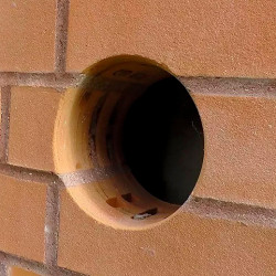 Cutting holes in brick for socket, unit.