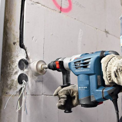 Cutting holes in concrete for socket box installation, unit.